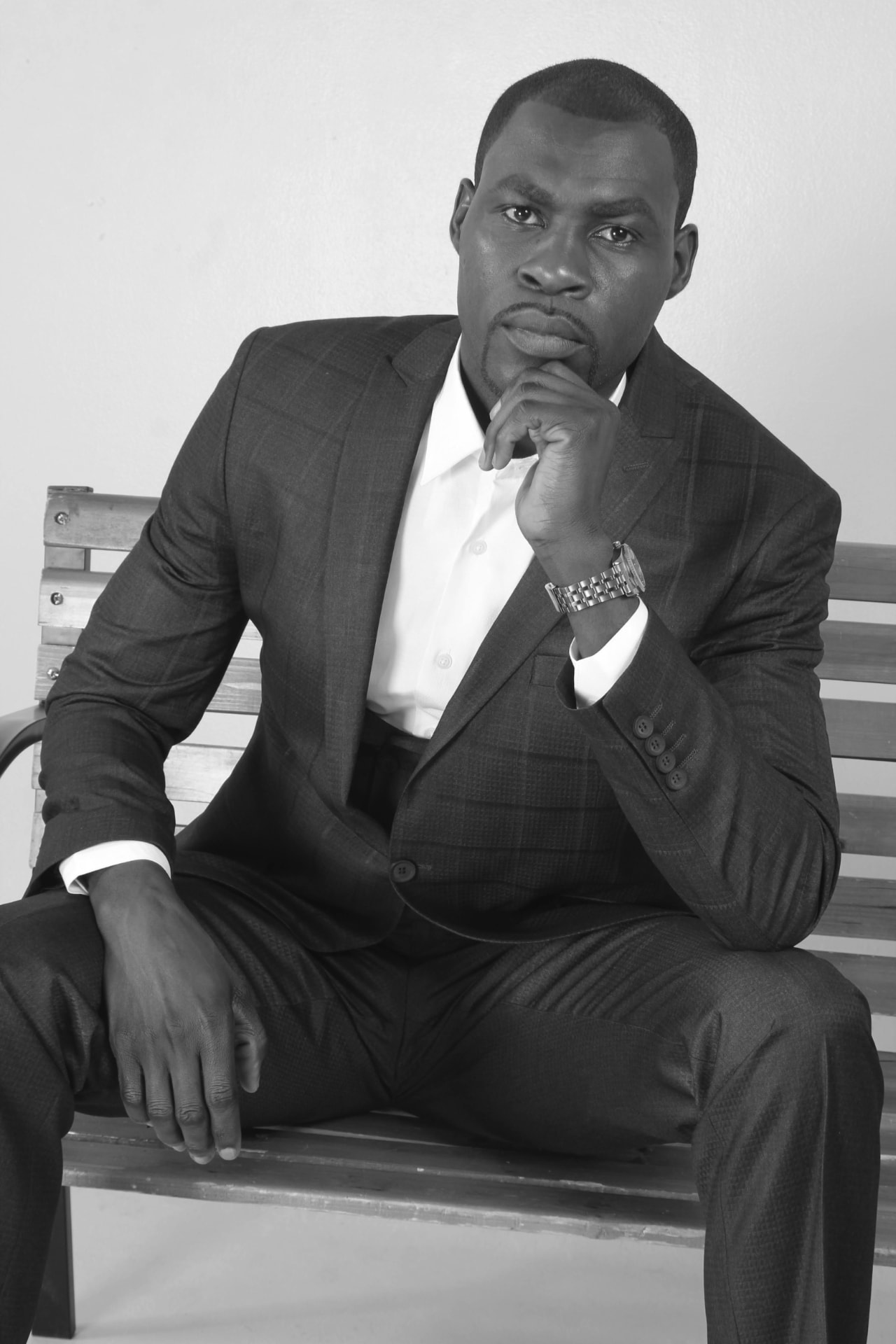 Daniel Cole seated in a suit